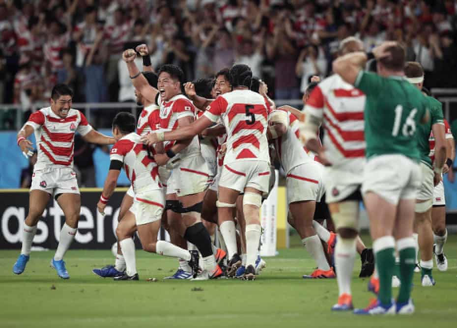 As the final whistle sounds, Japan players celebrate a rousing victory after a stunning second-half display saw off Ireland at Shizuoka Stadium Ecopa.