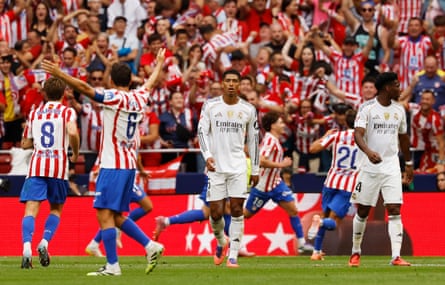 Atlético players celebrate around Jude Bellingham.