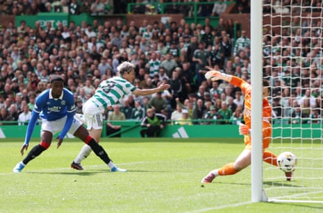 Celtic's Daizen Maeda scores their second goal past Rangers' Jack Butland.