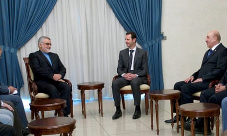Bashar al-Assad, centre, is joined by security chief Ali Mamlouk, right, at a meeting with Iranian parliamentarians. Mamlouk is accused of providing Samaha with explosives.