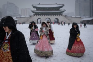 Visitors wearing traditional Korean Hanbok dress at Gyeongbokgung palace in central Seoul.