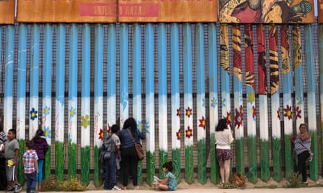Mexican Americans talk to their relatives through the current border fence – the one that Donald Trump has promised to replace with a wall – between Mexico and the USA.