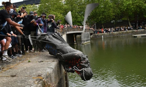 Protesters throw a toppled statue of slave trader  Edward Colston into Bristol harbour, June 2020.