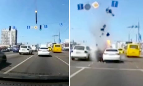 Missile debris narrowly misses cars in Kyiv – video
