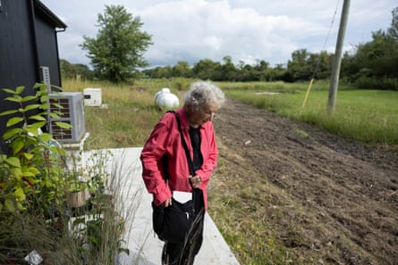 Atwood stands on the edge of a field