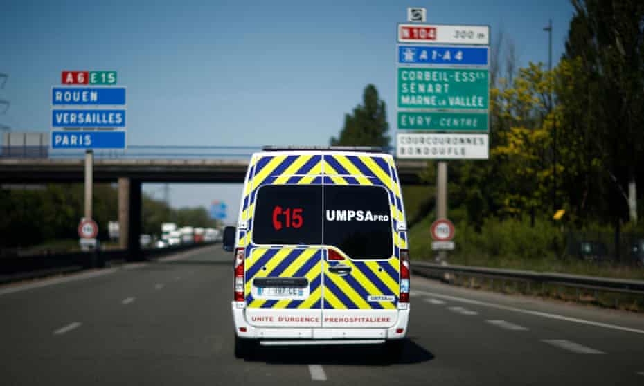 rear view of a French ambulance going along highway
