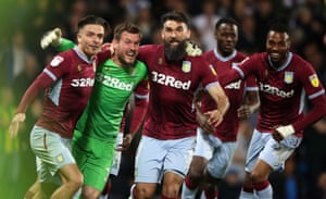 Aston Villa goalkeeper Jed Steer (second left) celebrates the victory with Jack Grealish (left) and Mile Jedinak.
