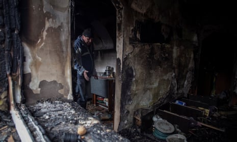 Anatolii, a local resident, walks inside his apartment destroyed by a Russian missile strike in Kostiantynivka, in the Donetsk region