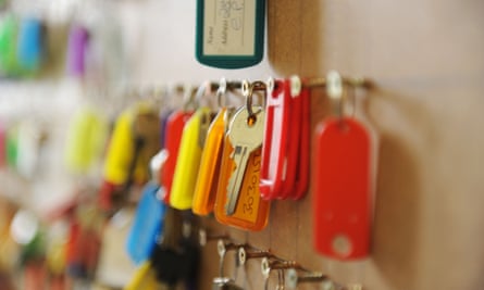 Keys to housing association houses hang on a keyboardKeys to housing association houses hang on a keyboard