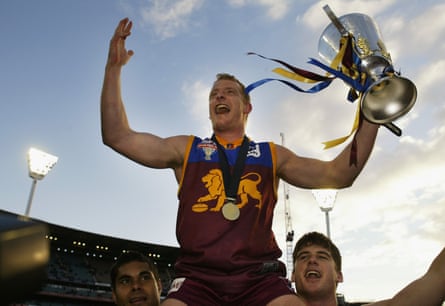 Michael Voss celebrates with the 2003 AFL premiership cup