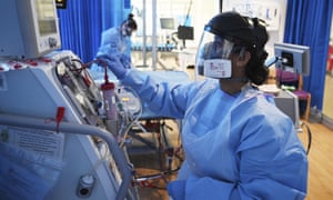 Staff caring for a Covid patient in a hospital intensive care unit in England.