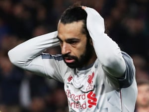 Liverpool’s Mohamed Salah rues his miss.