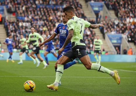 Leicester City's Timothy Castagne attempts to close down Manchester City’s Joao Cancelo before he can cross the ball.