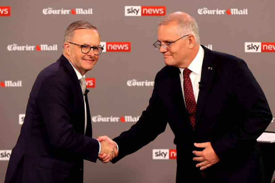 Scott Morrison (right) shakes hands with Anthony Albanese, during the first leaders' debate of the 2022 federal election campaign.