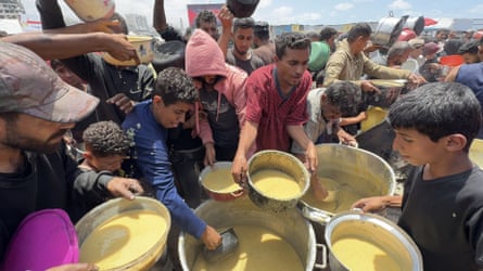 People queueing for food aid in Gaza City on 22 May 2025