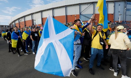 Scotland and Ukraine fans mingle outside Hampden Park before the game.