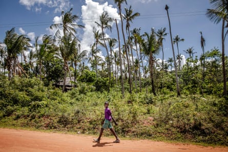 A boy walks from school towards his house in Junju, Kilifi County