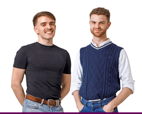 Colman and Ben stand smiling against a white background