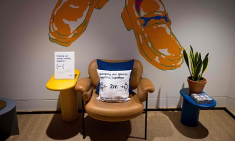Signage advising people to maintain a two-metre physical distance is seen at a WeWork co-working and office space in the City of London