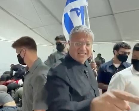 Screen grab of video showing Israeli national security minister Itamar Ben-Gvir carrying an Israeli flag.