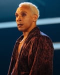 An actor in a leopard-print robe and gold chain performs on stage in Ilford Boy