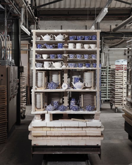 Shelving unit with different items of blue and white Burleigh pottery items