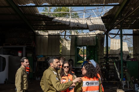 Israeli authorities inspect the damage of a building.
