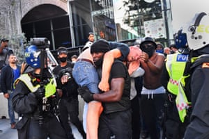 News Photographer of the Year winnerProtester Patrick Hutchinson carries an injured counter-protester to safety near London’s Waterloo station during a Black Lives Matter protest in June 2020.