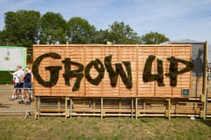 Grow Up written on some fencing