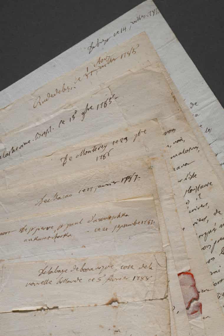 Several overlapping handwritten letters, from Jean-André Mongez, lie fanned across each other