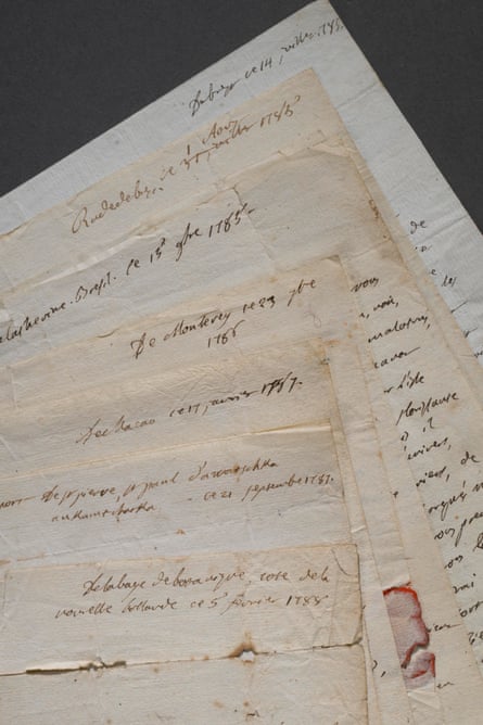 Several overlapping handwritten letters, from Jean-André Mongez, lie fanned across each other