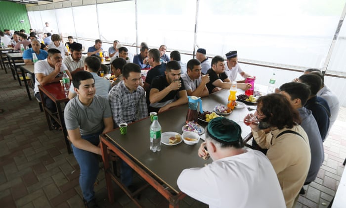 Muslims eat after praying during Eid al-Adha in Odesa, Ukraine