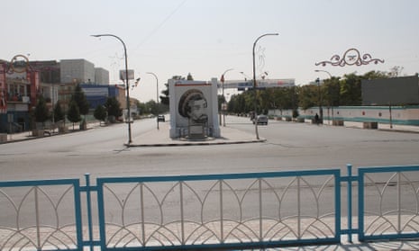 A view of a deserted road showing a monument with image of former Mujahideen commander Ahmad Shah Masood, in Mazar-e-Sharif, the provincial capital of Balkh province, Afghanistan, 14 August 2021.