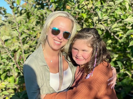 A mother and her daughter smiling.