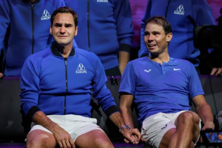 Roger Federer and Rafael Nadal in tears and holding hands following Federer’s final match before retirement last September.