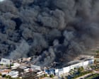 Thick black smoke rises from fire at California medical equipment warehouse – video