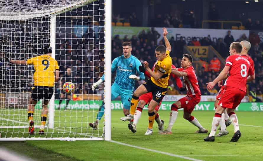 Conor Coady bundles in the second goal for Wolves.
