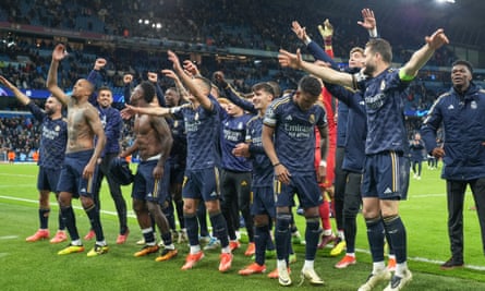 Real Madrid’s players celebrate in front of their fans at Manchester City
