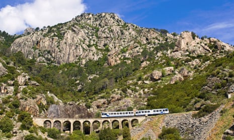 France, Haute Corse, the Trinighellu, the Corsican little train on a viaduct before the arrival in Venaco on the journey