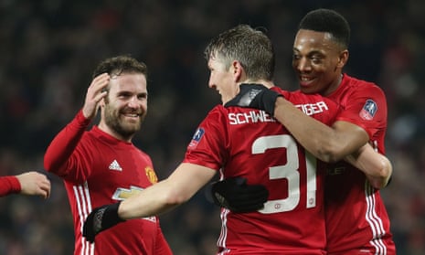 Juan Mata, Bastian Schweinsteiger and Anthony Martial celebrate Manchester United’s fourth goal.