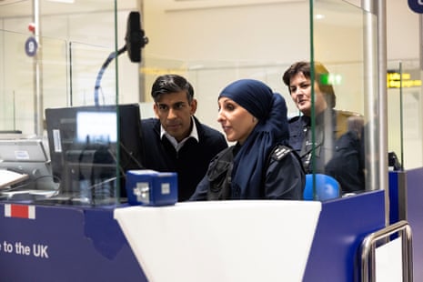 Rishi Sunak with Border Force officer Samira Bazzar on a visit today to inspect passport controls at Gatwick Airport.