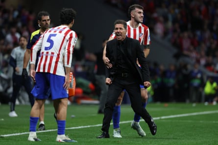 Diego Simeone reacts with emotion on the touchline with his players.