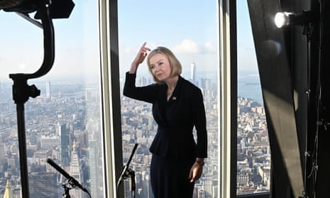 Liz Truss speaks to the media at the top of the Empire State Building in New York