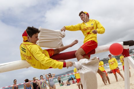 Lifeguards on Bondi beach take part in a pillow fight challenge.