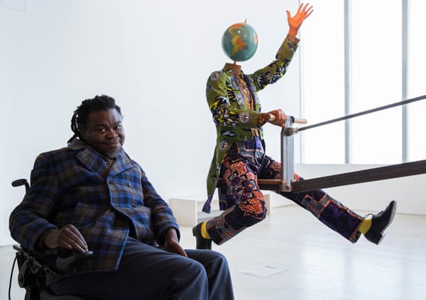 Yinka Shonibare MBE with his work End of Empire.