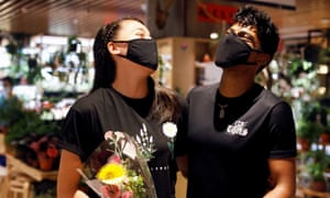 Couple Tareesh and Phebe share a laugh after they are reunited after weeks of ciruit breaker lockdown in Singapore, 19 June 2020.