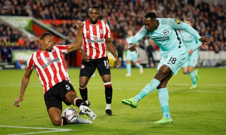 Brentford's Ethan Pinnock blocks a shot from Brighton's Danny Welbeck.