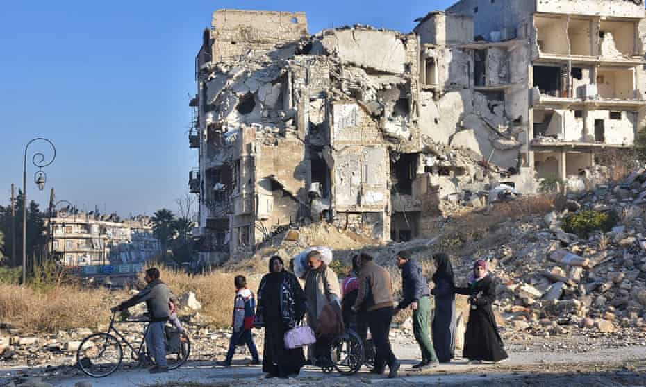 Syrian residents fleeing the violence in the eastern rebel-held parts of Aleppo