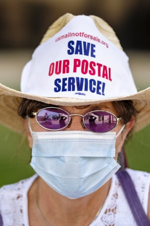 Save The Post Office Rally In Des Moines, Iowa. Julie Backson, a retired postal worker, participates in rally to save the Postal Service at the Neal Smith Federal Building in Des Moines. About 100 people, postal workers and members of the public, came to the Neal Smith Federal Building earlier this month to call for increased spending for the US Postal Service and an end to attacks on the USPS by members of the Trump administration.