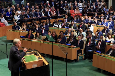 Guterres stands at a lectern, facing rows of seated UN delegates